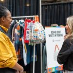Sabrina at a tradeshow 2 people in picture